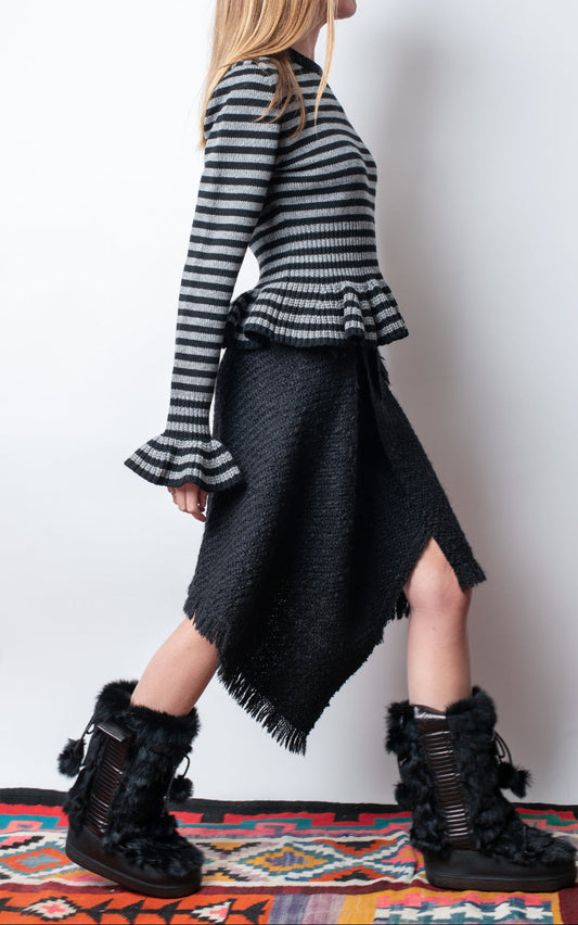 Falda sobre con flecos